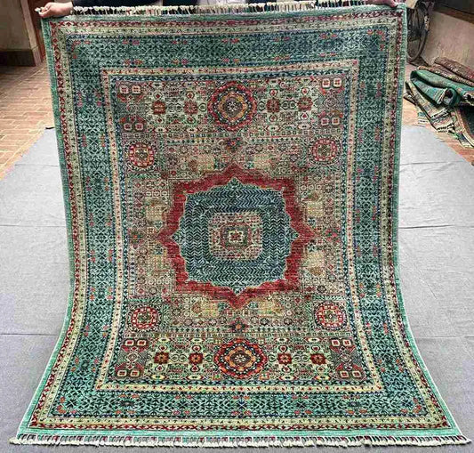 Full view of 5x7 handmade Mamluk rug in red and green tones