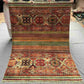 Full flat-lay of 5x7 handmade tribal red Khorjin wool rug