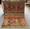 Full flat-lay of 5x7 handmade tribal red Khorjin wool rug