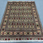 5x7 Persian-style Oriental rug displayed on floor – red and floral patterns
