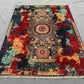5x7 modern oriental rug placed in living room with bold decor