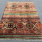  Knotted Afghan-style wool rug used in minimalist home interior