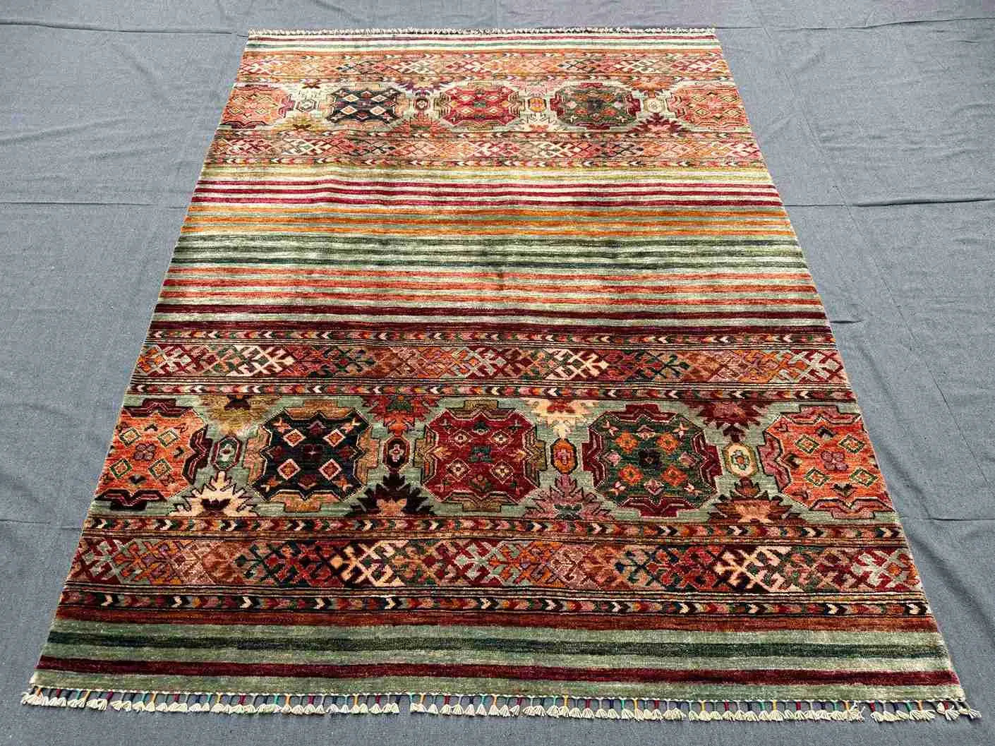  Knotted Afghan-style wool rug used in minimalist home interior