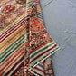  Folded front view of 5x7 handmade tribal Khorjin wool rug