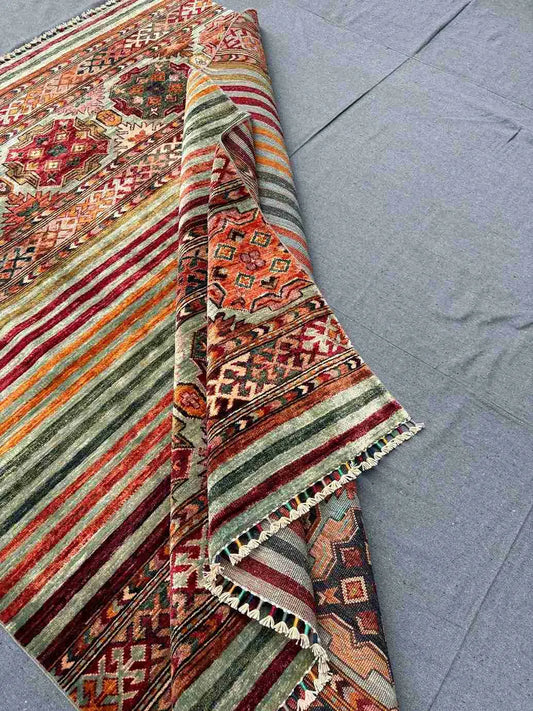  Folded front view of 5x7 handmade tribal Khorjin wool rug