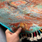 Front view of 5x8 multicolor Mamluk rug held by hand