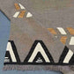Folded front of 6x9 Kilim rug showing lightweight flatweave material.