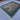 Handmade 7x9 Oriental rug displayed in living room – vibrant wool and silk design