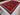 Persian red area rug laid on hardwood floor