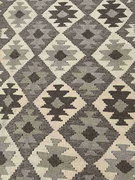 Close-up of earthy toned Kilim runner rug weave texture