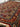Back view of handmade Afghan wool rug being held, revealing quality knots.