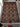 Knotted Afghan area rug in oriental style placed on hardwood flooring.