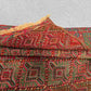 Folded handmade Afghan wool rug showing thickness and softness