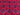 Close-up of red and navy tribal geometric pattern on rug