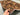 4x6.4 antique Baluchi war rug held in hands showing tribal wool weave and thickness
