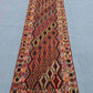  2.8x9.3 antique kilim runner rug laid on tiled surface