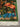 Corner view of handmade silk wall hanging with fine tropical motifs.
