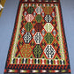  Authentic Turkish flatweave rug shown on hardwood floor.