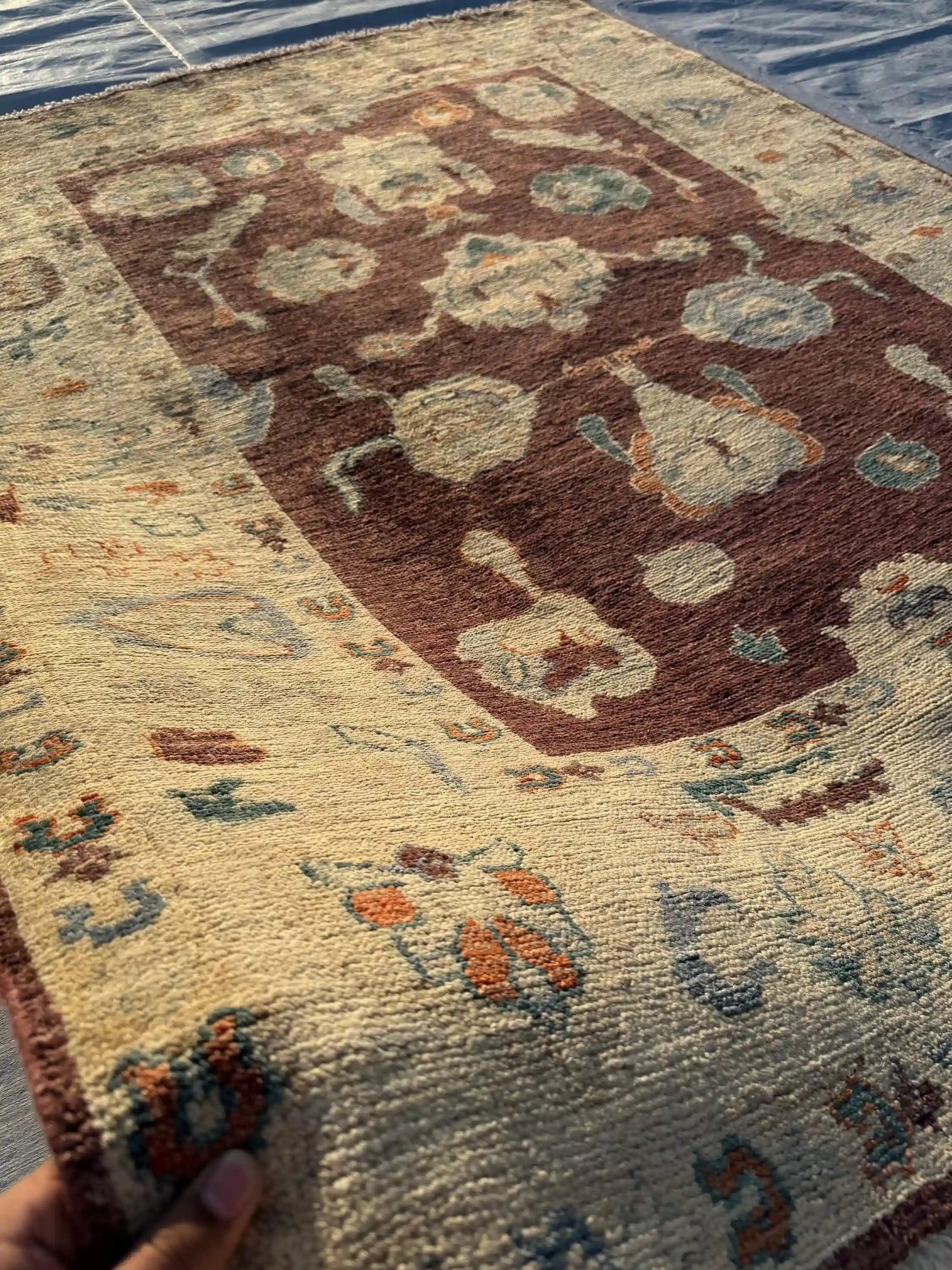 5x7 ft authentic Oushak rug in hands – handwoven oriental wool area rug