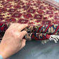 Authentic Turkish handmade rug showing knotted wool silk texture in hand