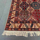 Corner view of authentic hand-knotted Waziri Oriental rug