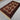 Baluch wool rug placed on floor in bohemian living room