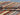 Side view of folded Barjasta wool rug – handmade and knotted