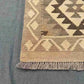 Corner detail of 13ft Kilim runner rug – flatweave wool design in earthy beige and brown.