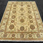 Knotted wool 5x7 Chobi rug in beige tones on hardwood floor.