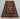 Full view of handmade black and beige wool rug on wooden floor