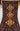 Full top view of handmade black and beige vintage Persian-style area rug