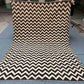 Full layout of handmade Kilim wool rug in black and ivory