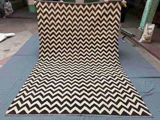 Full layout of handmade Kilim wool rug in black and ivory
