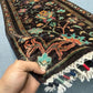 Handmade Black Sultani Wool Runner Rug 2.6x8.2 ft shown in hands – Persian style knotted hallway rug