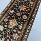 Detailed stitching of knotted handmade Persian-style runner rug
