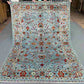 Complete view of 6x8 handmade blue and gray oriental rug