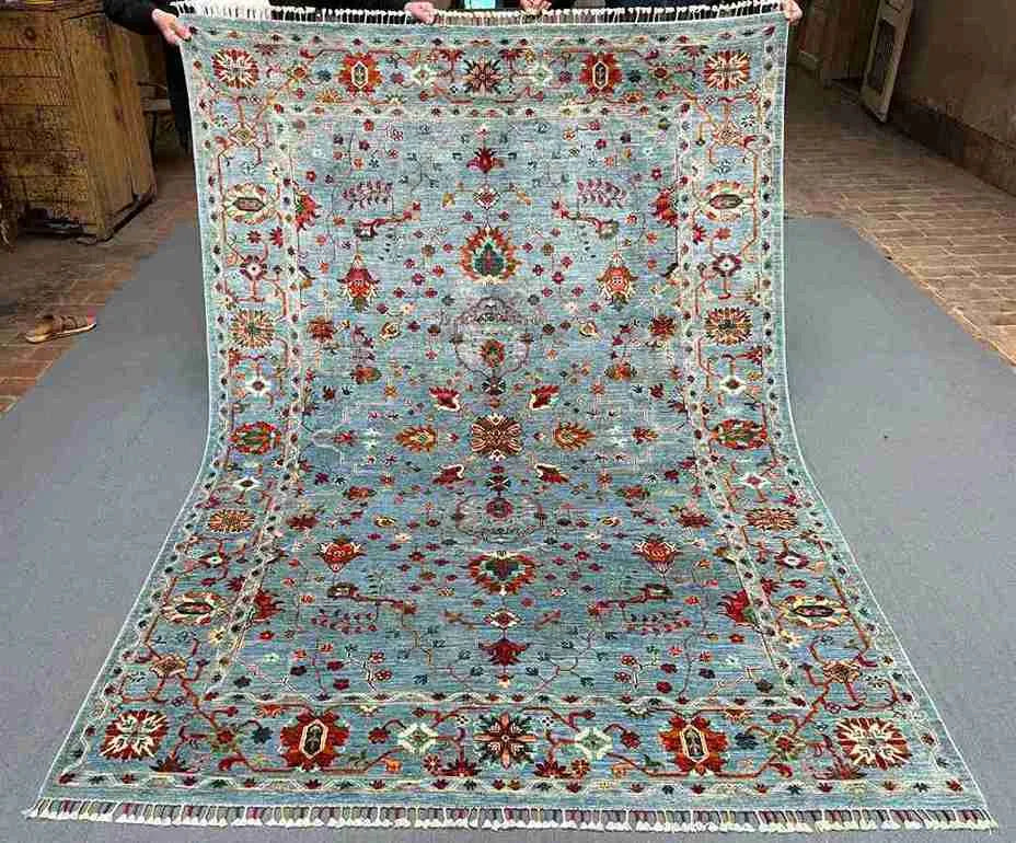Complete view of 6x8 handmade blue and gray oriental rug