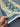  Handmade blue and ivory Turkish Ziegler runner rug held for texture view