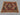 Afghan kilim rug styled on floor with boho-inspired home decor