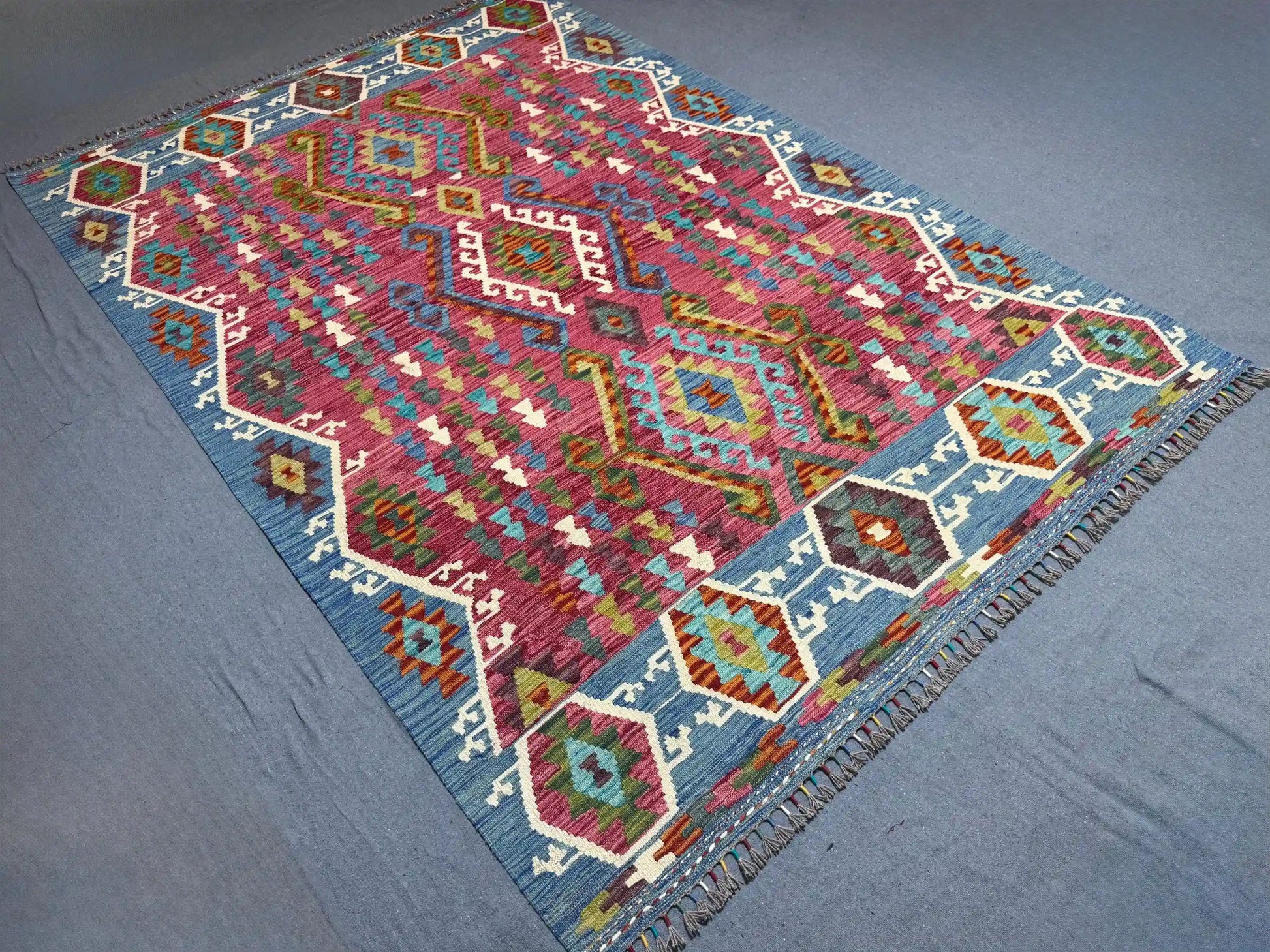 Boho-style Turkish rug with tribal patterns displayed on modern flooring.