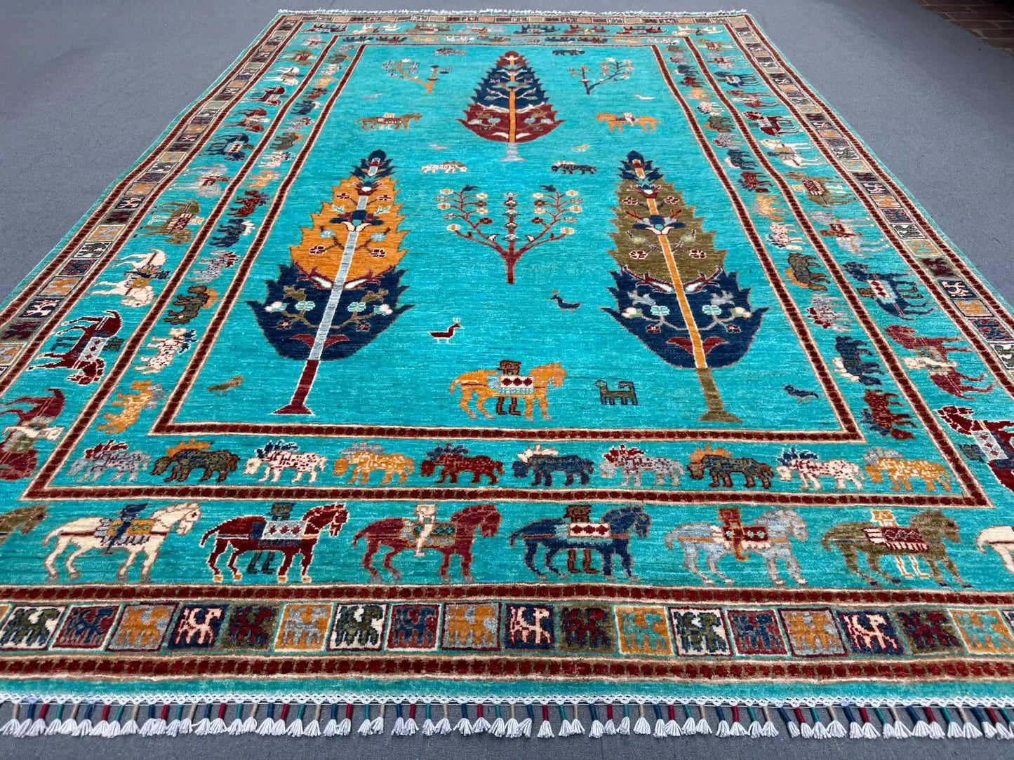 Close-up of botanical motif on Tree of Life handmade wool rug