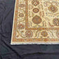 Corner floral detail on authentic 5x7 ivory Chobi rug – Persian-style design.