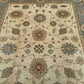 Close-up of beige and green floral pattern on Chobi wool rug
