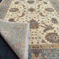 Pattern detail of folded 6x8 beige and green Chobi carpet