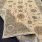 Side view of handmade Chobi rug in folded form