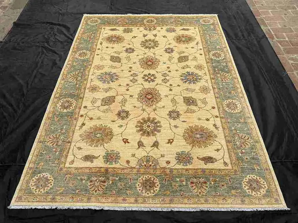 Handmade Chobi rug laid on living room floor in natural light