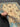 Knotted Beige & Teal Wool Chobi Rug held in hands