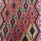 Close-up of handwoven geometric pattern on Turkish kilim wool rug