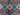 Close-up of handmade multicolor Persian-style rug with bold geometric patterns