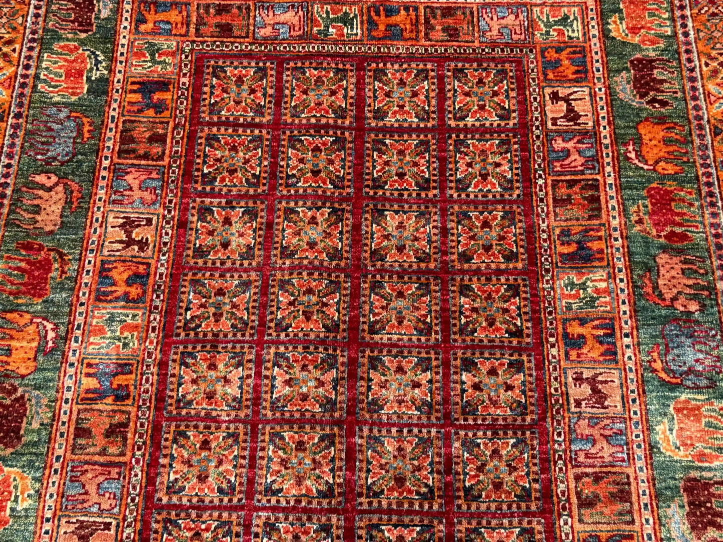 Close-up of wool Pazyryk rug with tribal pattern